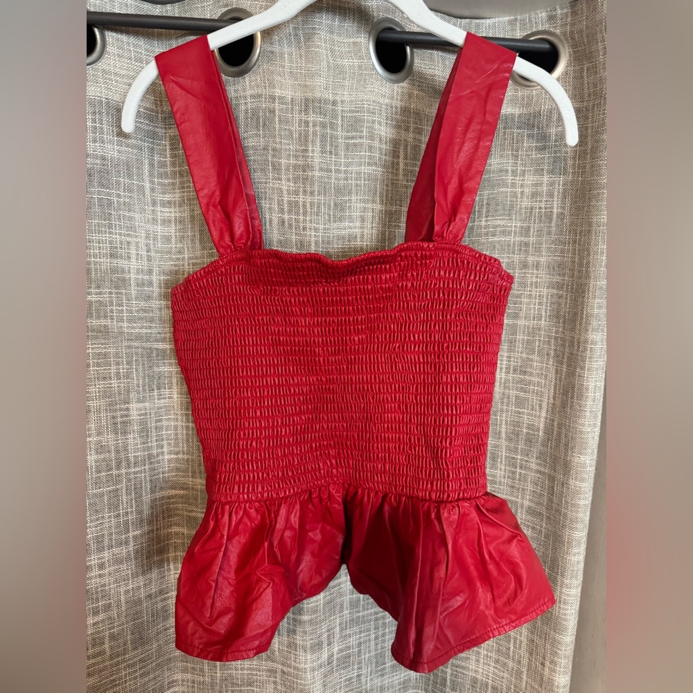 Red sleeveless peplum top